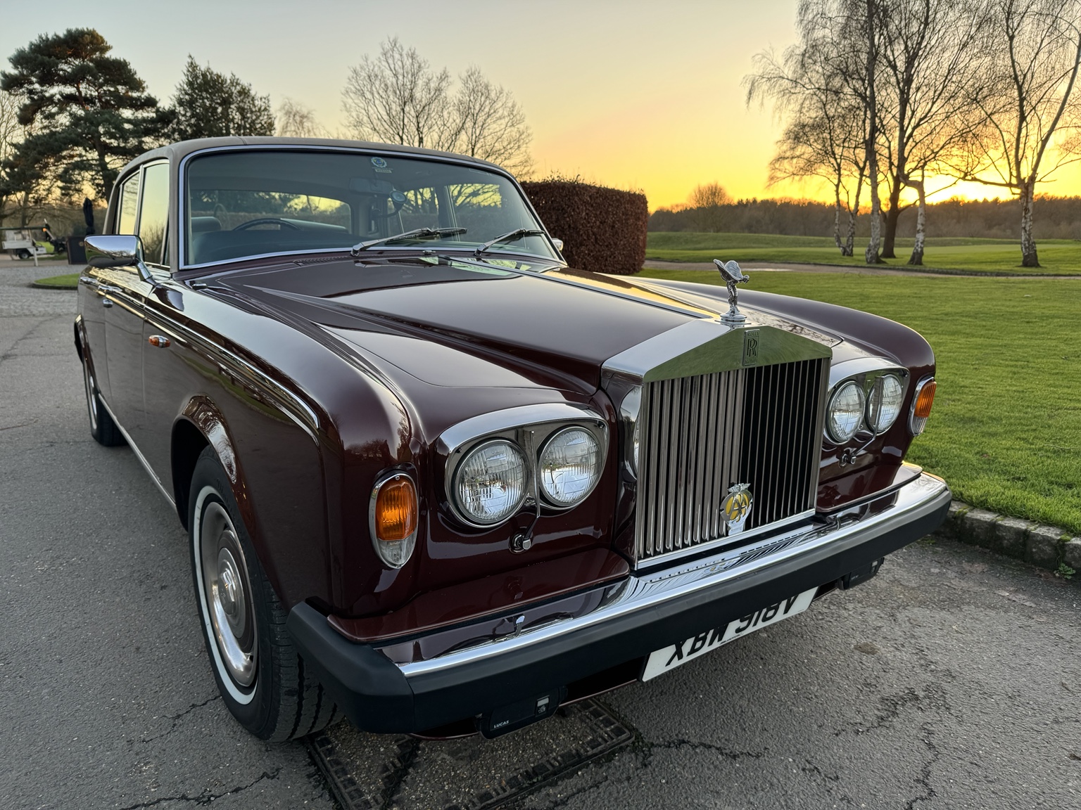 Burgundy Rolls-Royce classic car